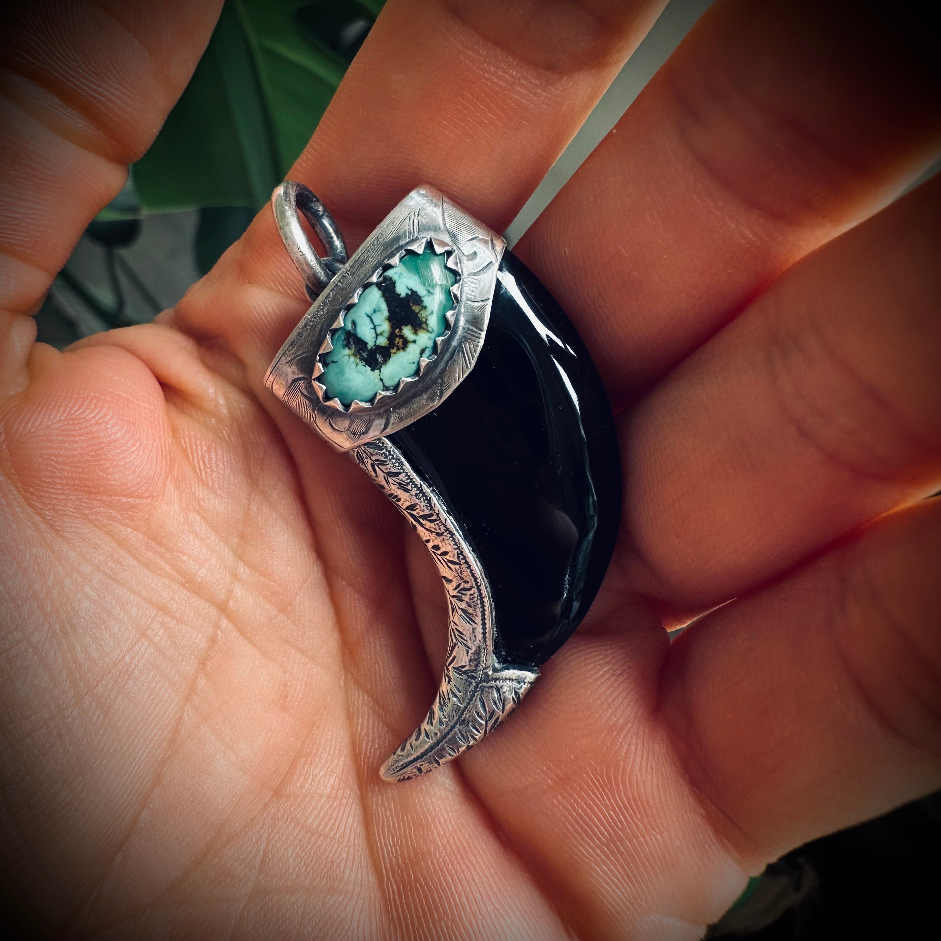 Carved onyx claw style pendant with turquoise in hallmarked sterling silver