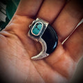 Sterling silver hallmarked claw-style pendant with turquoise and black buffalo horn