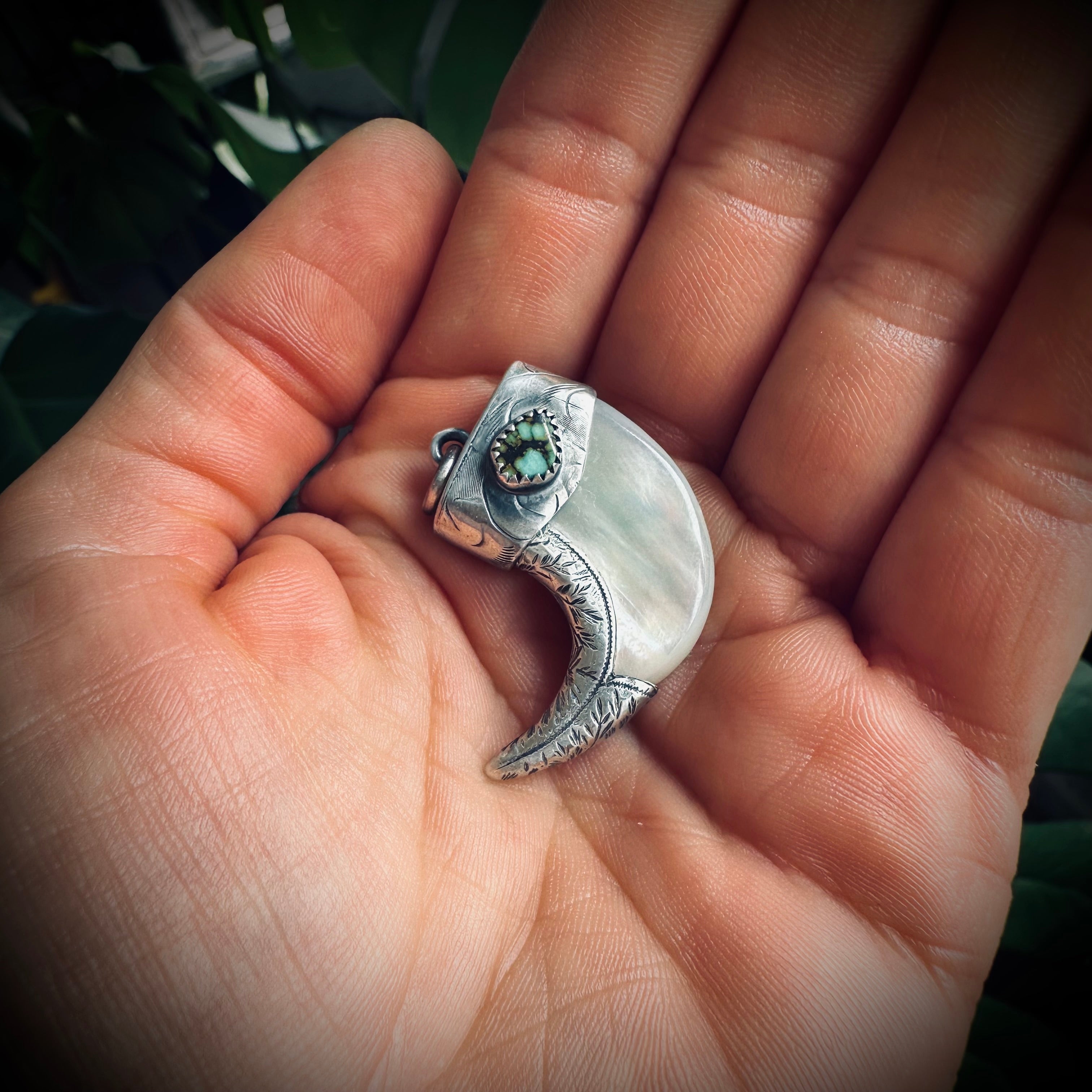 Mother of pearl claw style pendant with turquoise in hallmarked sterling silver