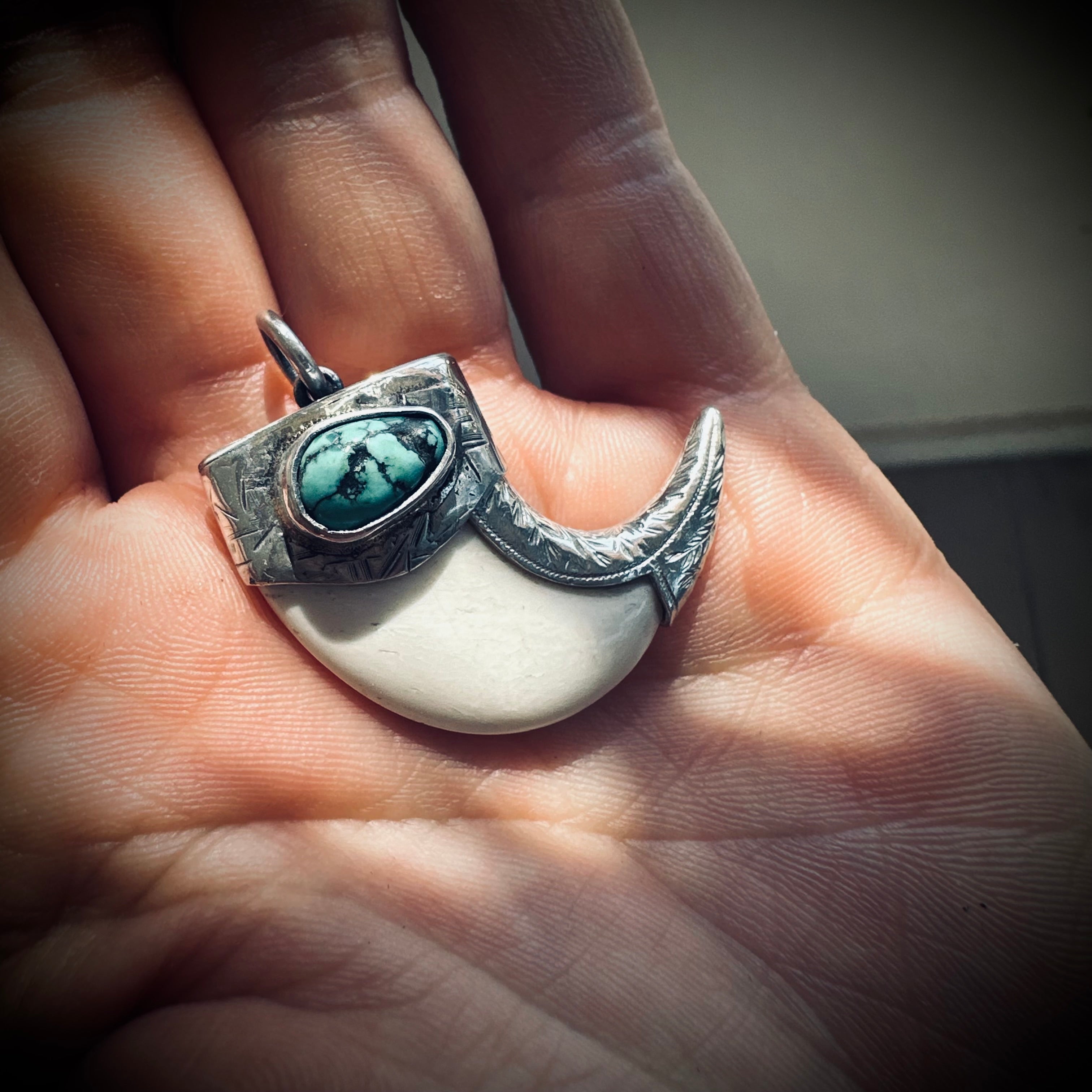 Sterling silver hallmarked claw-style pendant with turquoise and deer antler