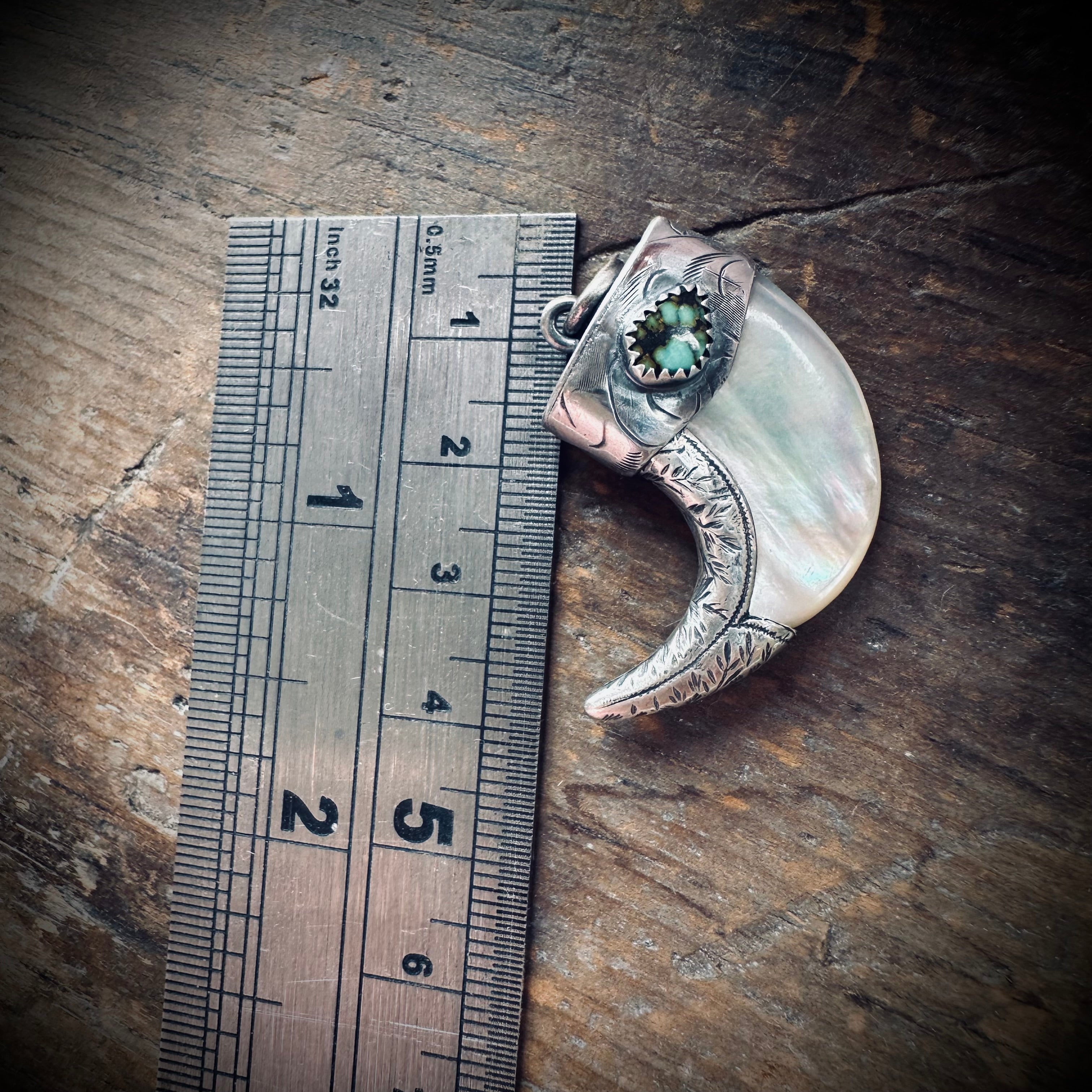 Mother of pearl claw style pendant with turquoise in hallmarked sterling silver