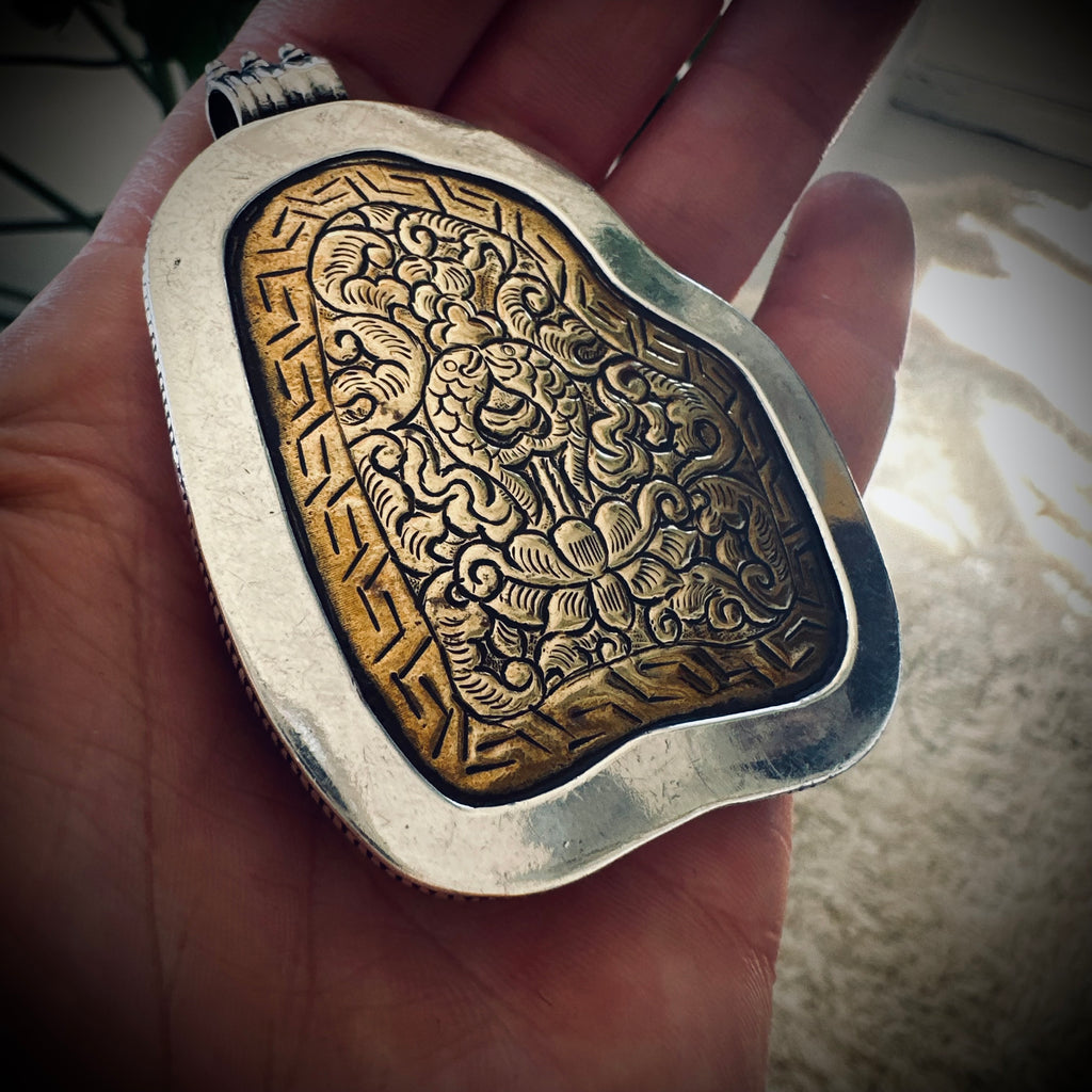 Vintage large turquoise slab pendant in silver contrasting brass engraved backing