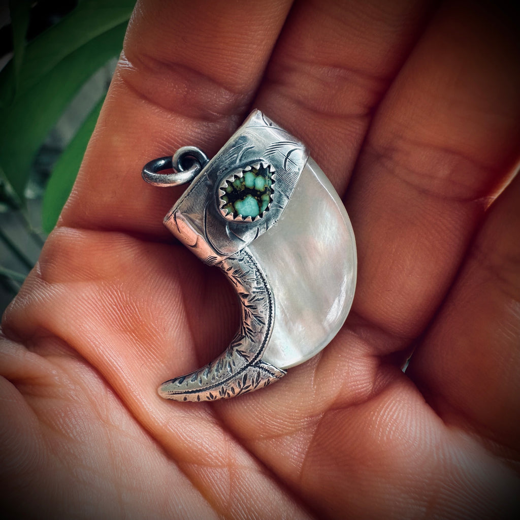 Mother of pearl claw style pendant with turquoise in hallmarked sterling silver