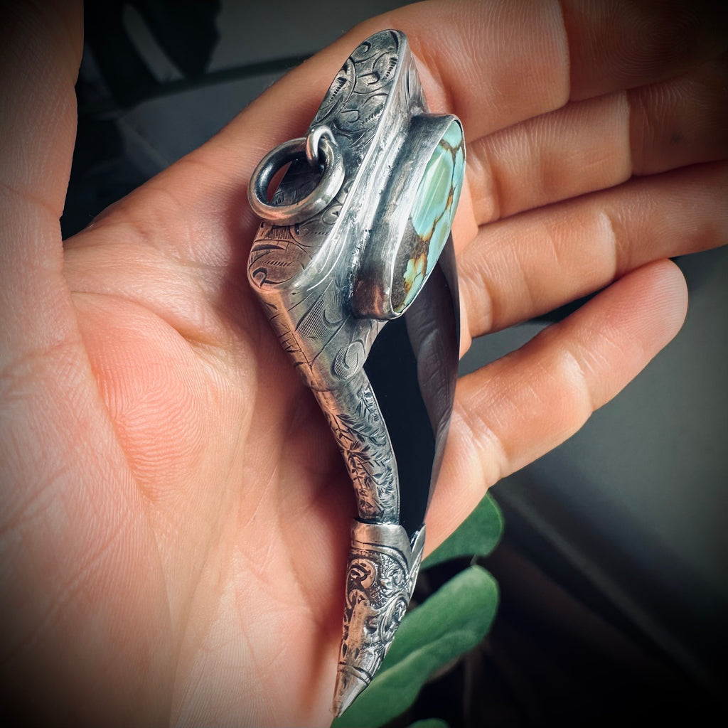 Carved onyx claw style pendant with turquoise in hallmarked sterling silver