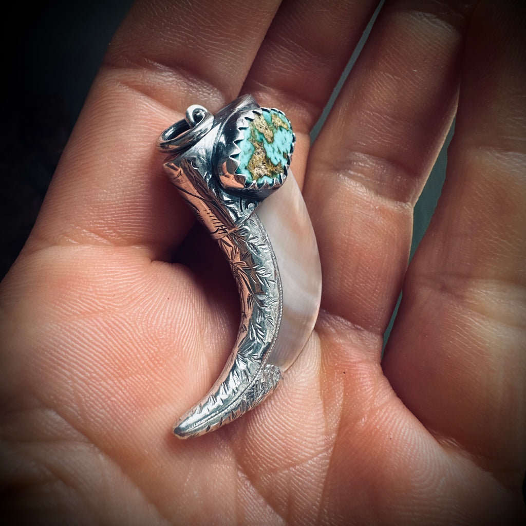 Hallmarked sterling silver and turquoise claw pendant in mother of pearl