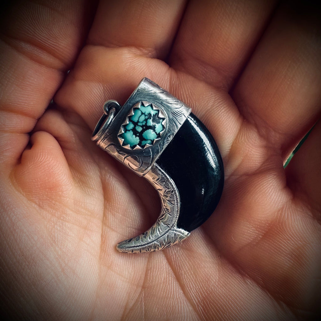 Carved buffalo horn “claw” pendant with turquoise in hallmarked sterling silver