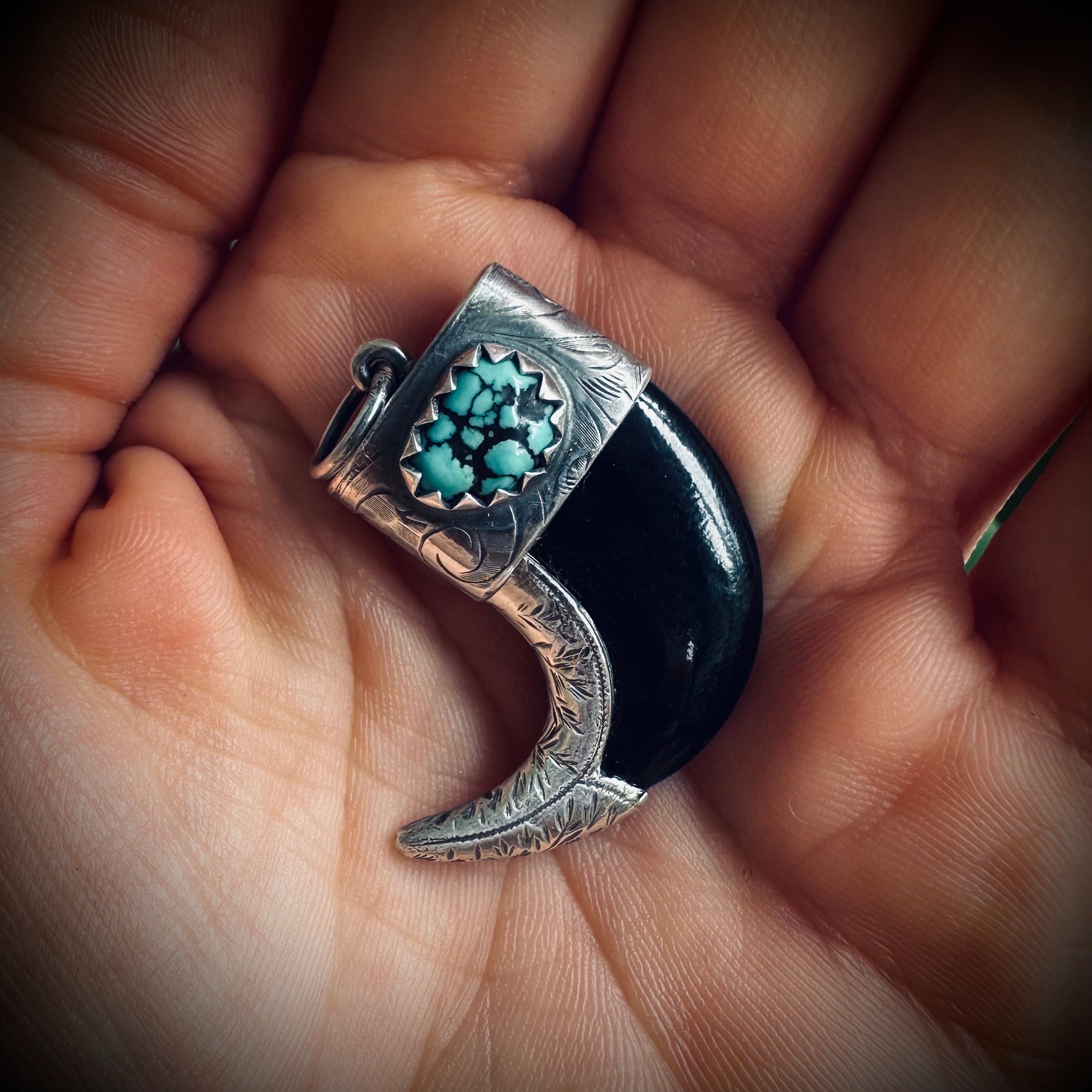 Carved buffalo horn “claw” pendant with turquoise in hallmarked sterling silver