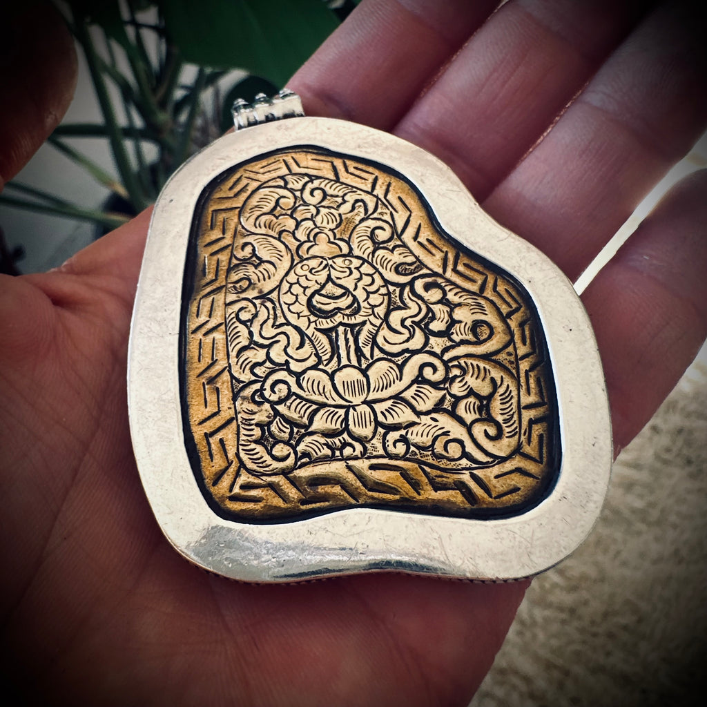 Vintage large turquoise slab pendant in silver contrasting brass engraved backing