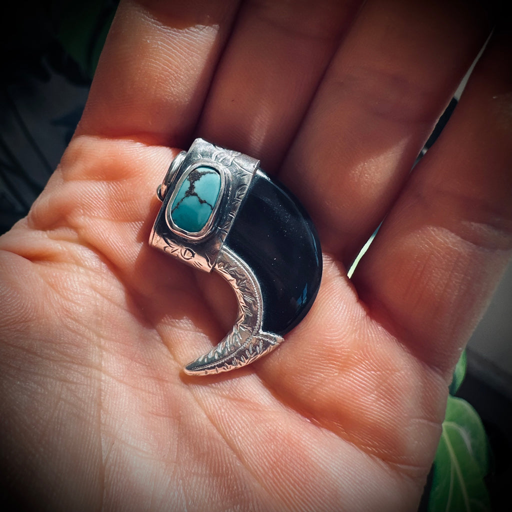 Sterling silver hallmarked claw-style pendant with turquoise and black buffalo horn