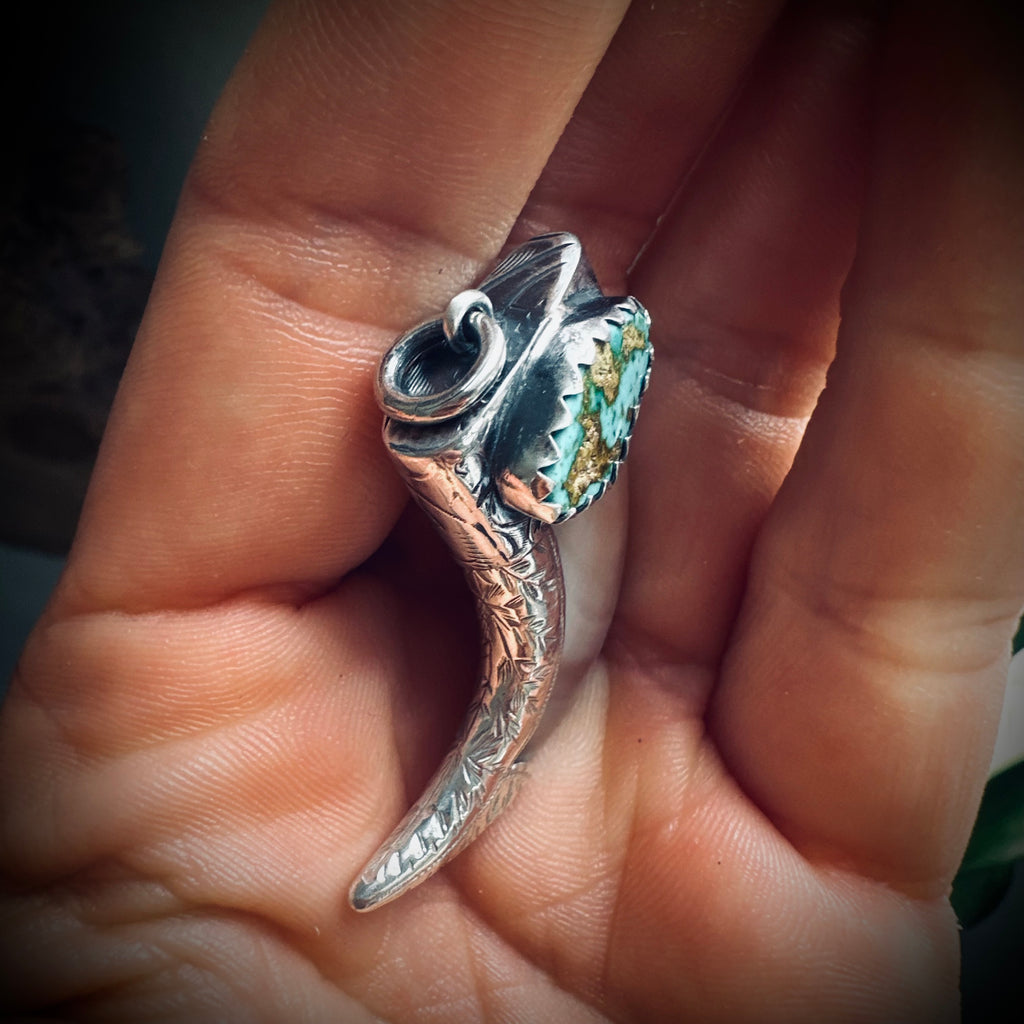 Hallmarked sterling silver and turquoise claw pendant in mother of pearl
