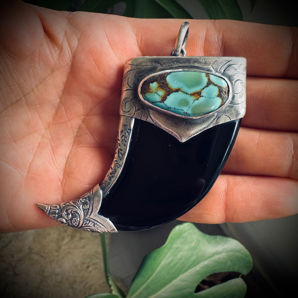 Carved onyx claw style pendant with turquoise in hallmarked sterling silver