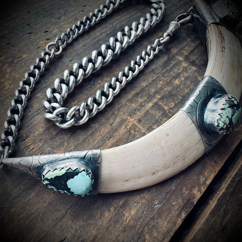 4.5” boars tusk with turquoise on 12.5” antique sterling silver Albert chain