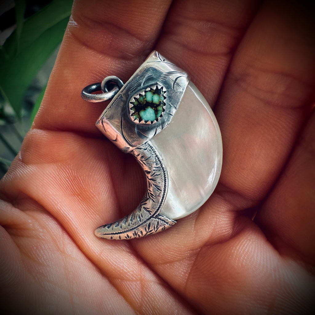 Mother of pearl claw style pendant with turquoise in hallmarked sterling silver