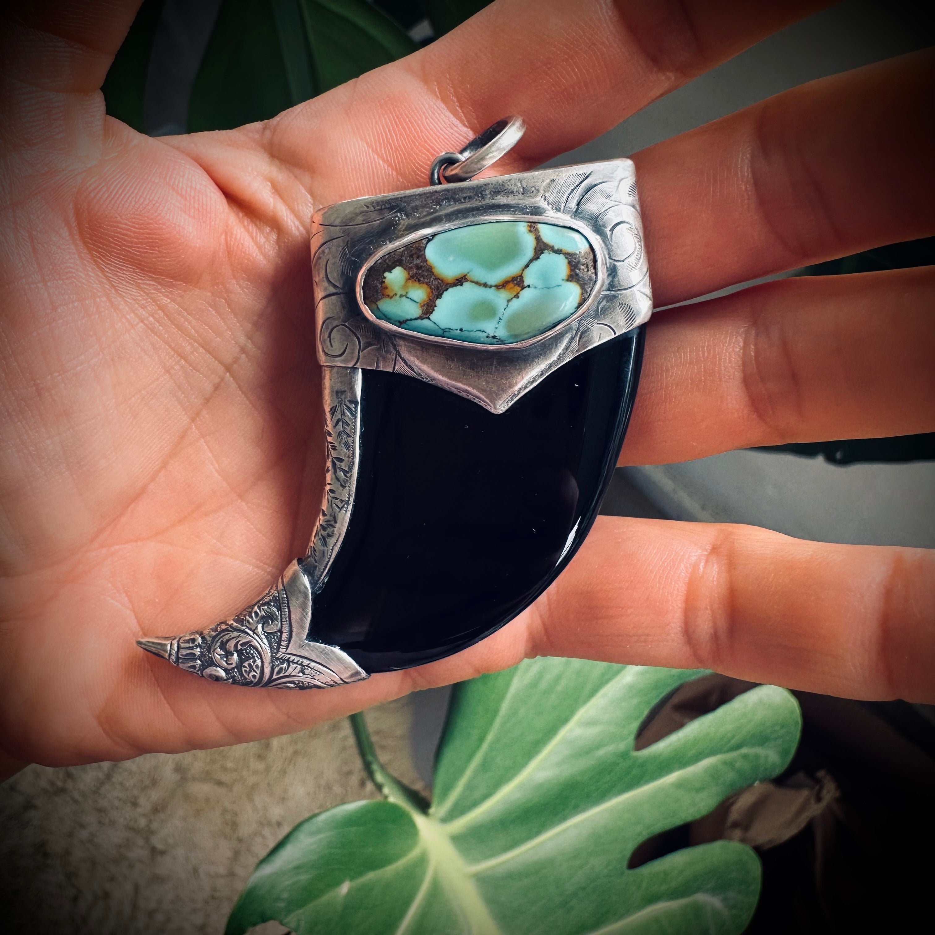 Carved onyx claw style pendant with turquoise in hallmarked sterling silver