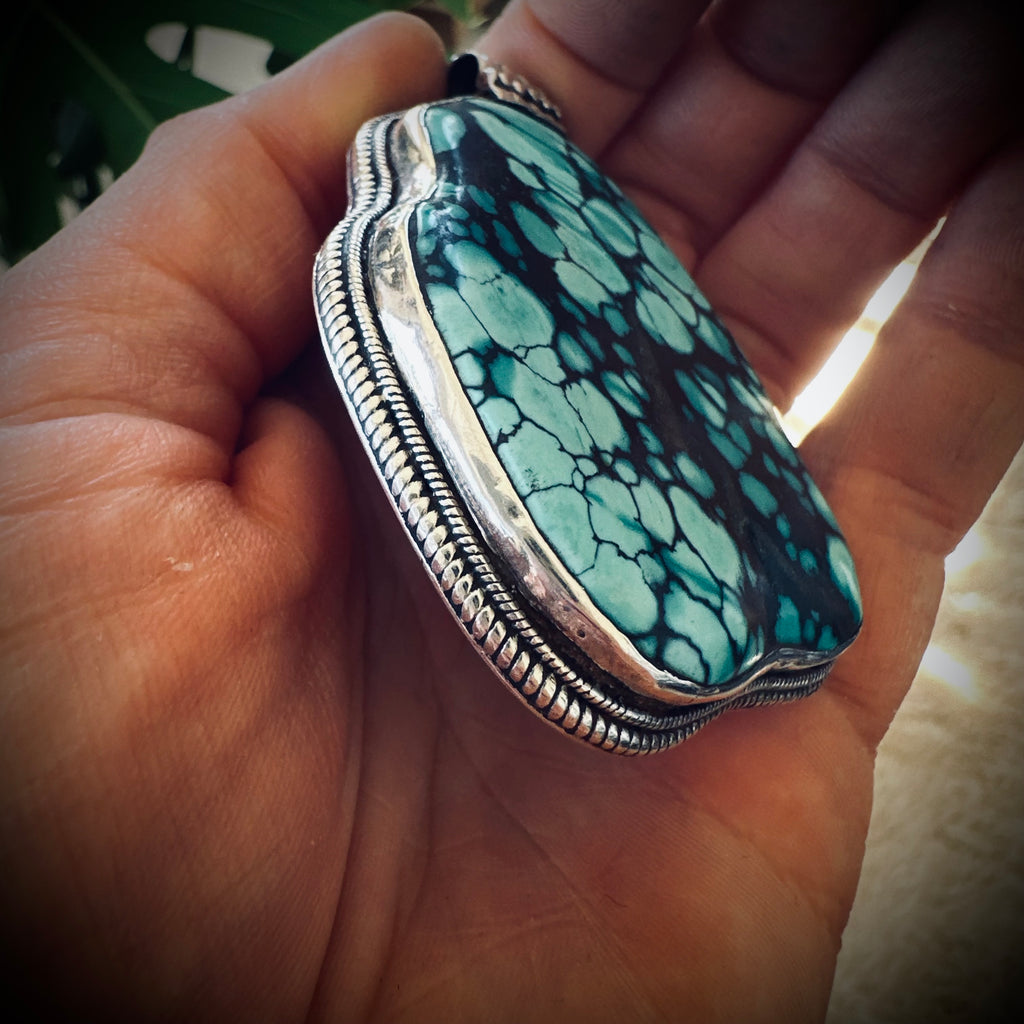 Vintage large turquoise slab pendant in silver contrasting brass engraved backing