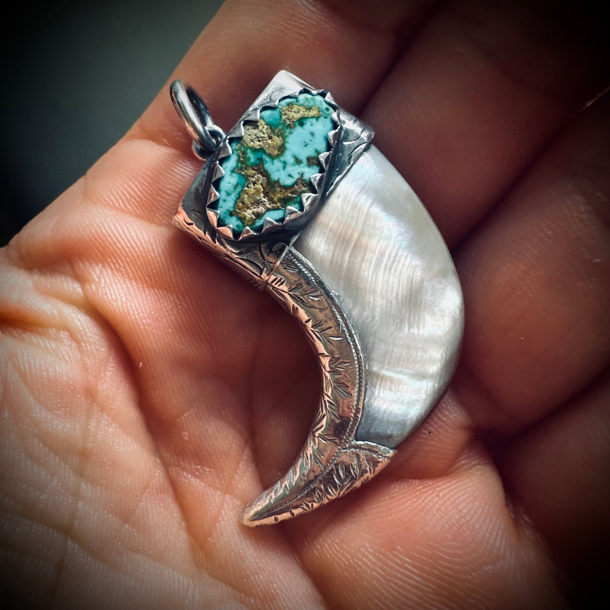 Hallmarked sterling silver and turquoise claw pendant in mother of pearl