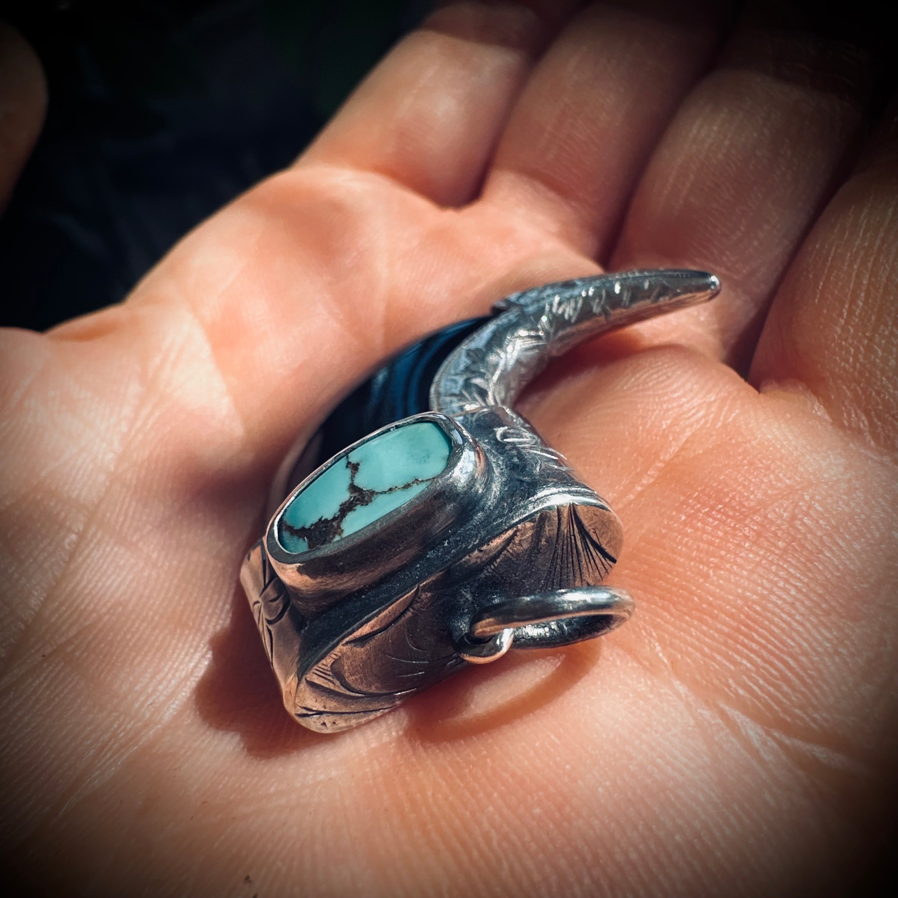 Sterling silver hallmarked claw-style pendant with turquoise and black buffalo horn