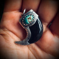 Carved buffalo horn claw style pendant with turquoise in hallmarked sterling silver