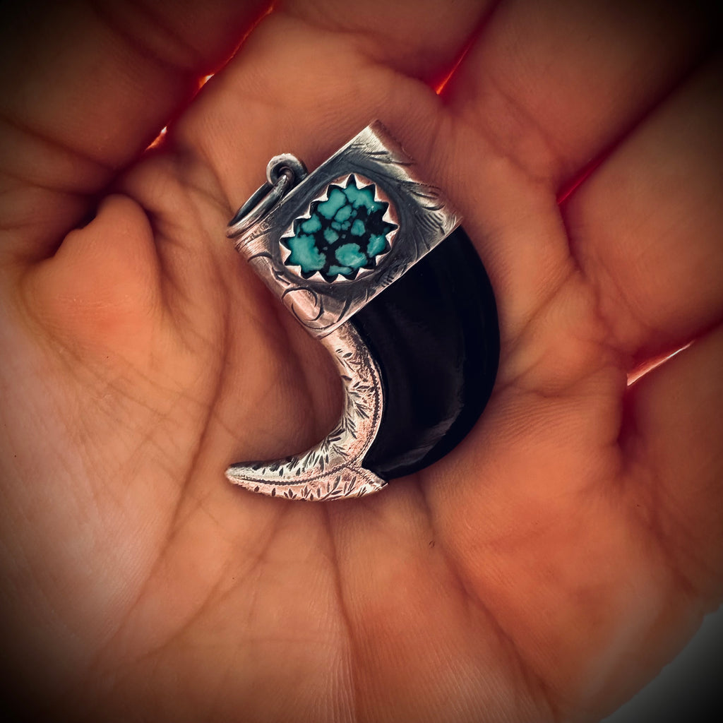 Carved buffalo horn “claw” pendant with turquoise in hallmarked sterling silver
