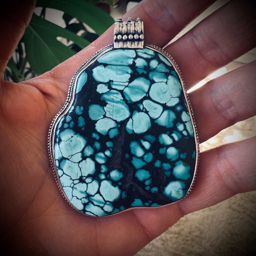 Vintage large turquoise slab pendant in silver contrasting brass engraved backing