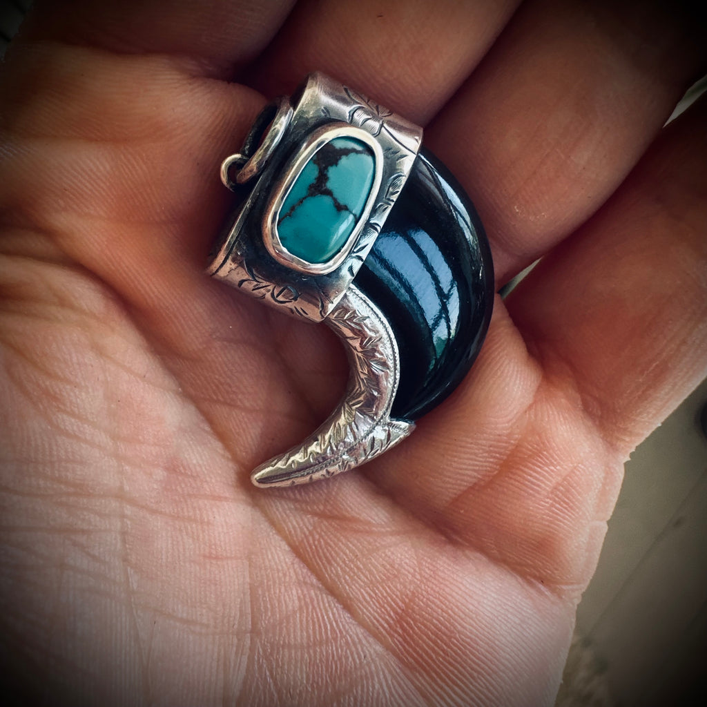 Sterling silver hallmarked claw-style pendant with turquoise and black buffalo horn