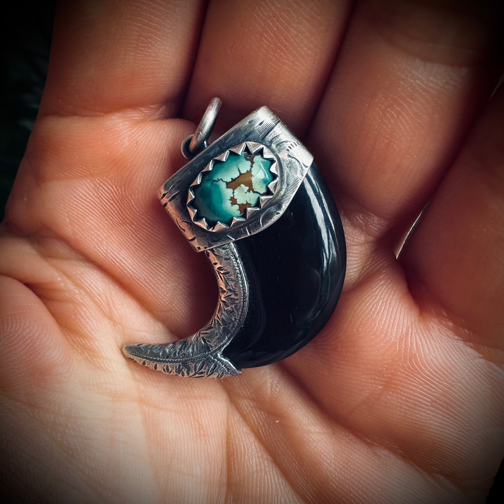 Carved buffalo horn claw style pendant with turquoise in hallmarked sterling silver