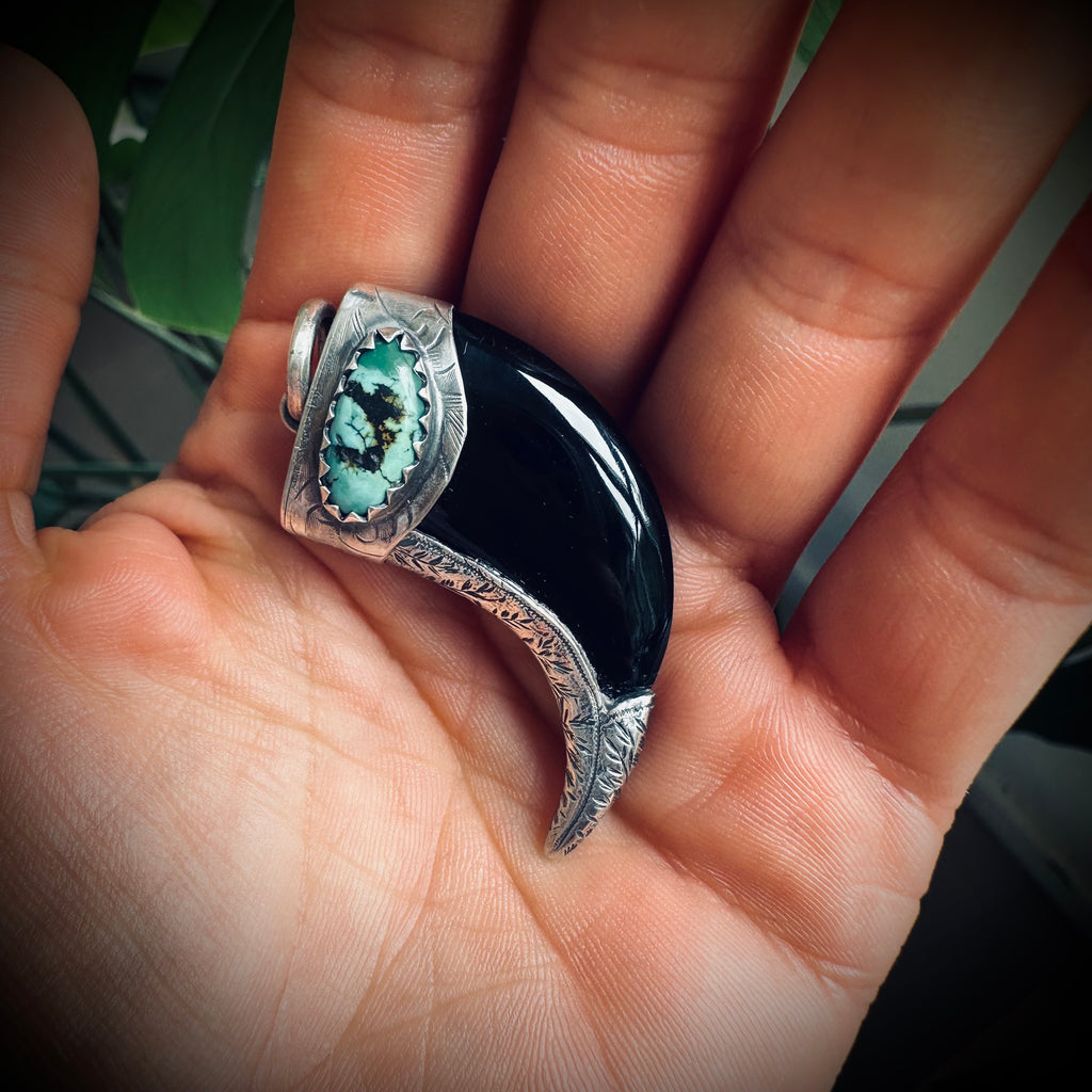 Carved onyx claw style pendant with turquoise in hallmarked sterling silver