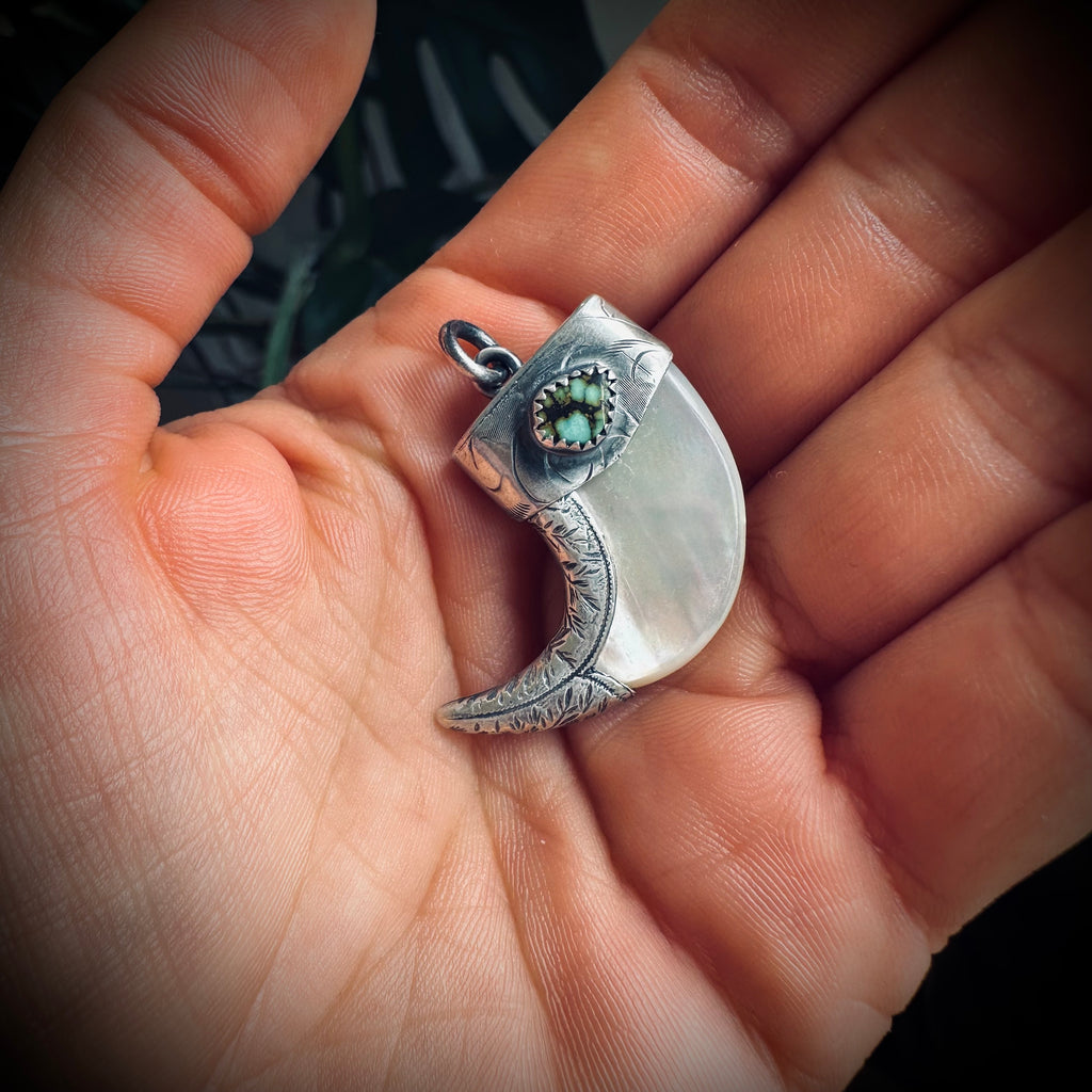 Mother of pearl claw style pendant with turquoise in hallmarked sterling silver