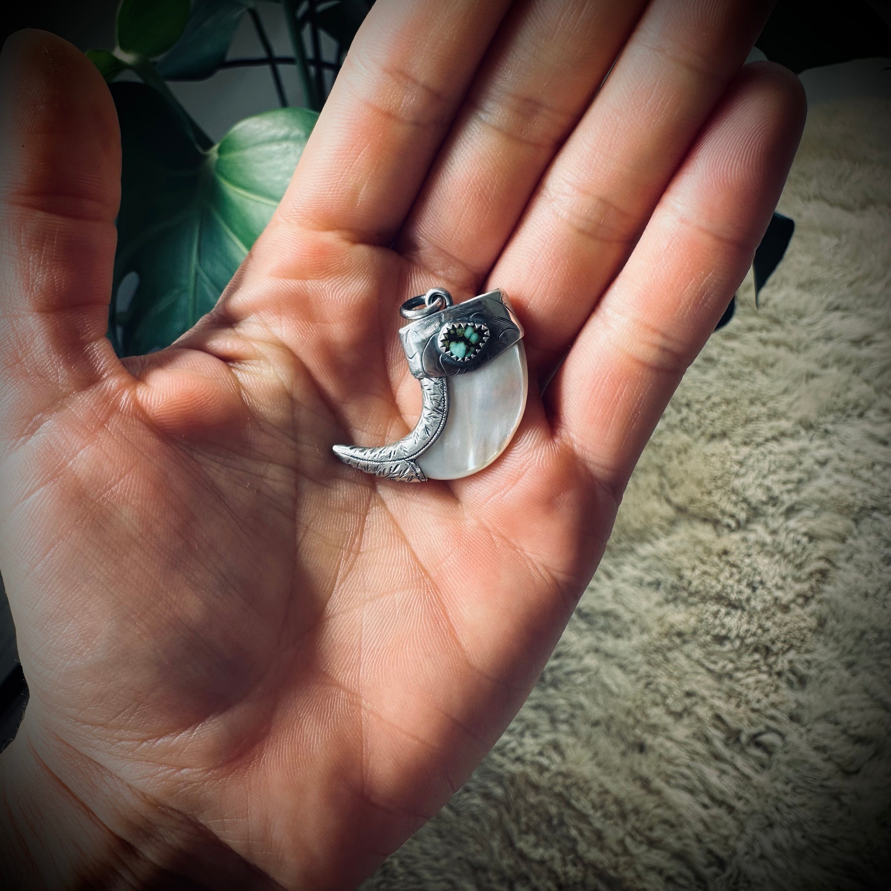 Mother of pearl claw style pendant with turquoise in hallmarked sterling silver