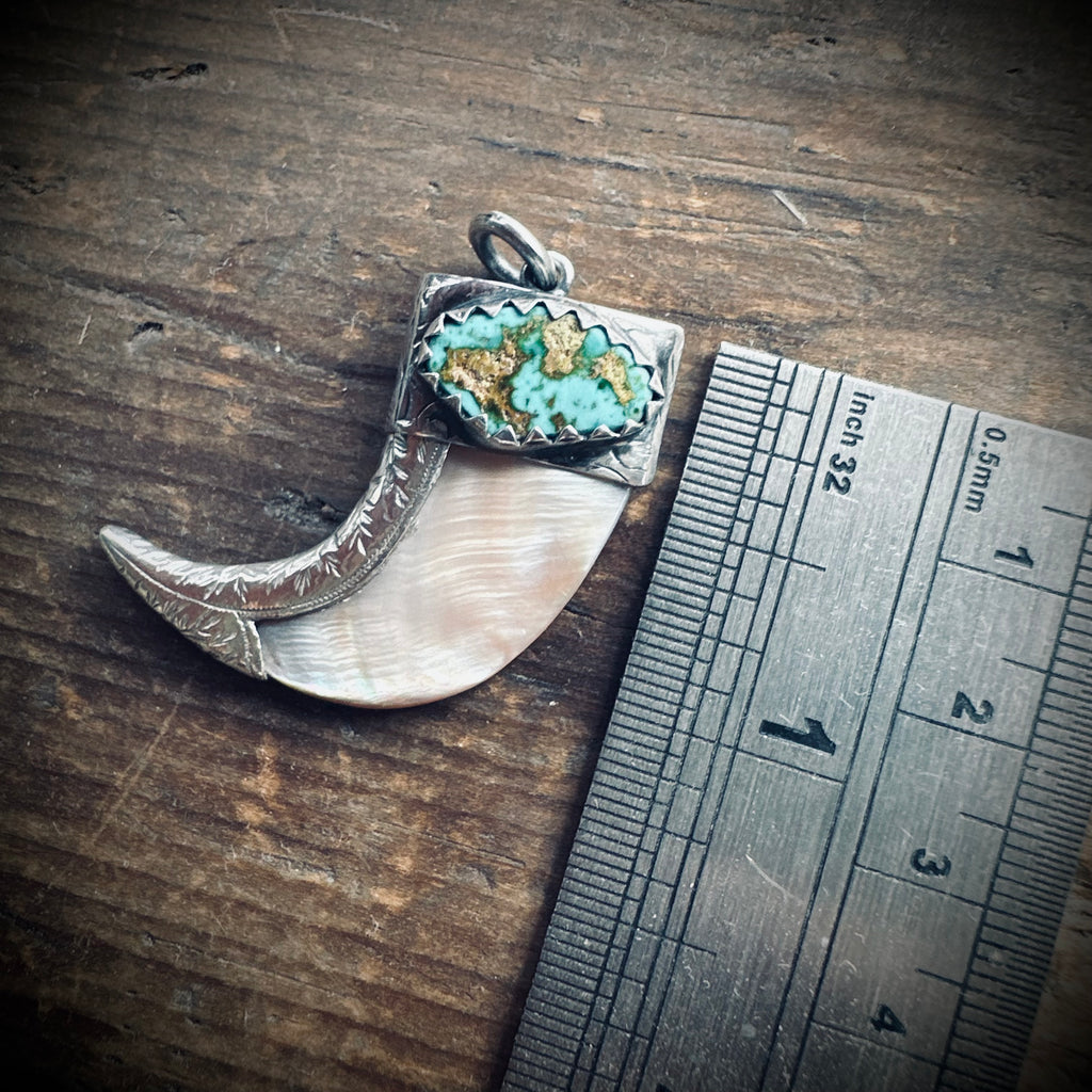 Hallmarked sterling silver and turquoise claw pendant in mother of pearl