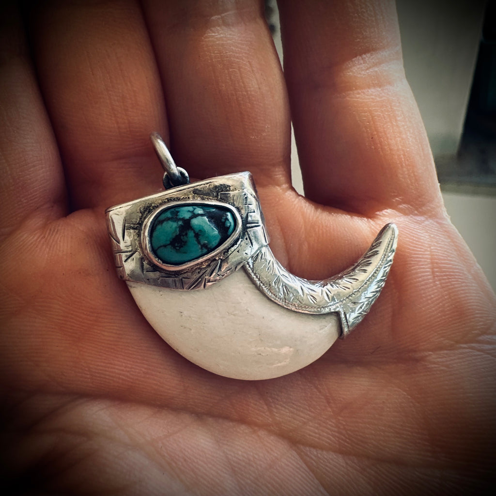Sterling silver hallmarked claw-style pendant with turquoise and deer antler