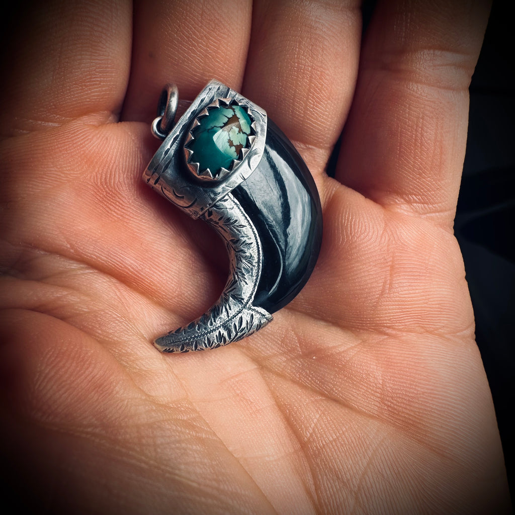 Carved buffalo horn claw style pendant with turquoise in hallmarked sterling silver