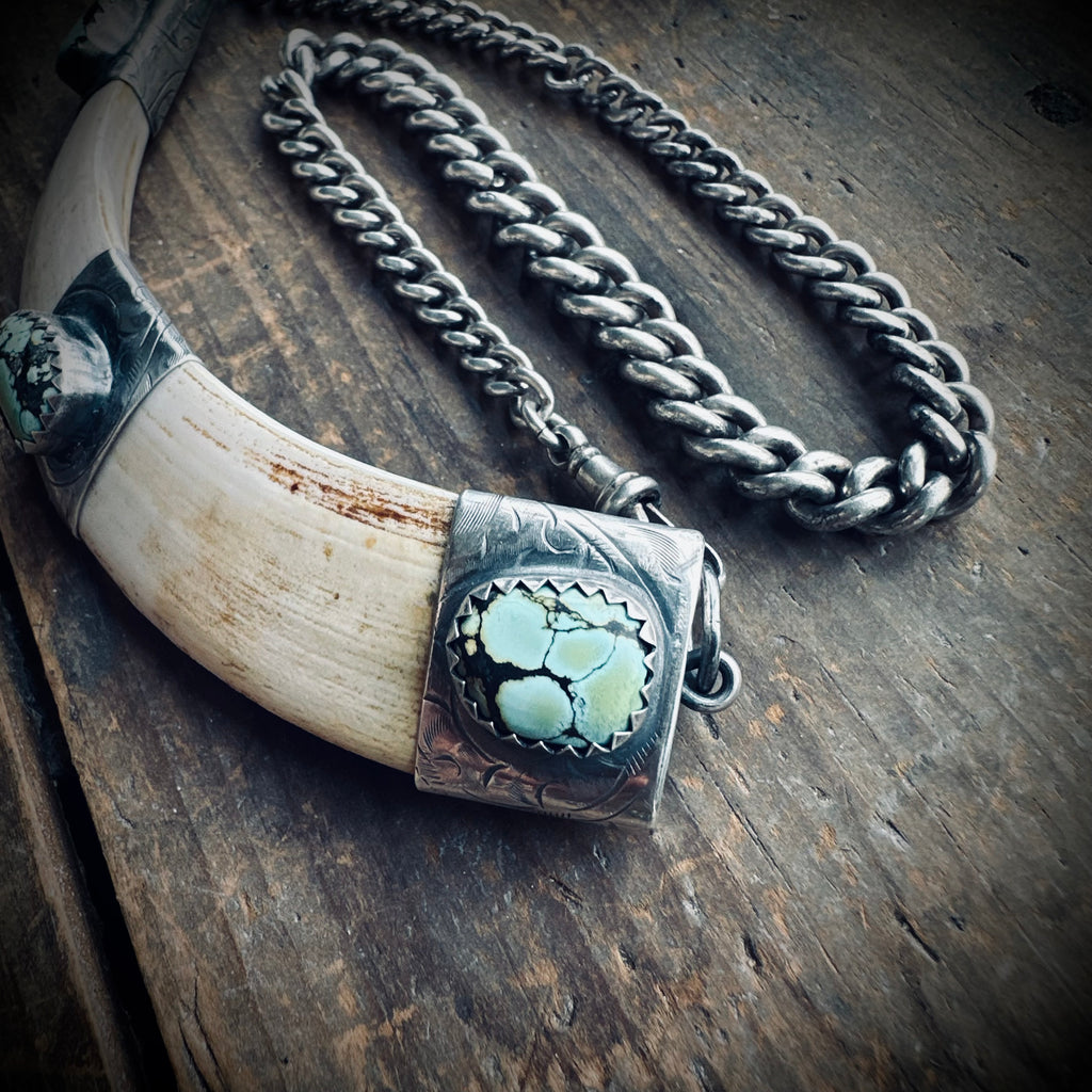 4.5” boars tusk with turquoise on 12.5” antique sterling silver Albert chain