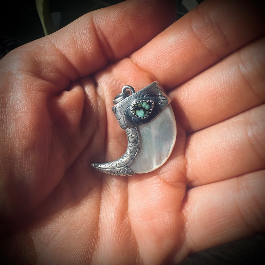 Mother of pearl claw style pendant with turquoise in hallmarked sterling silver