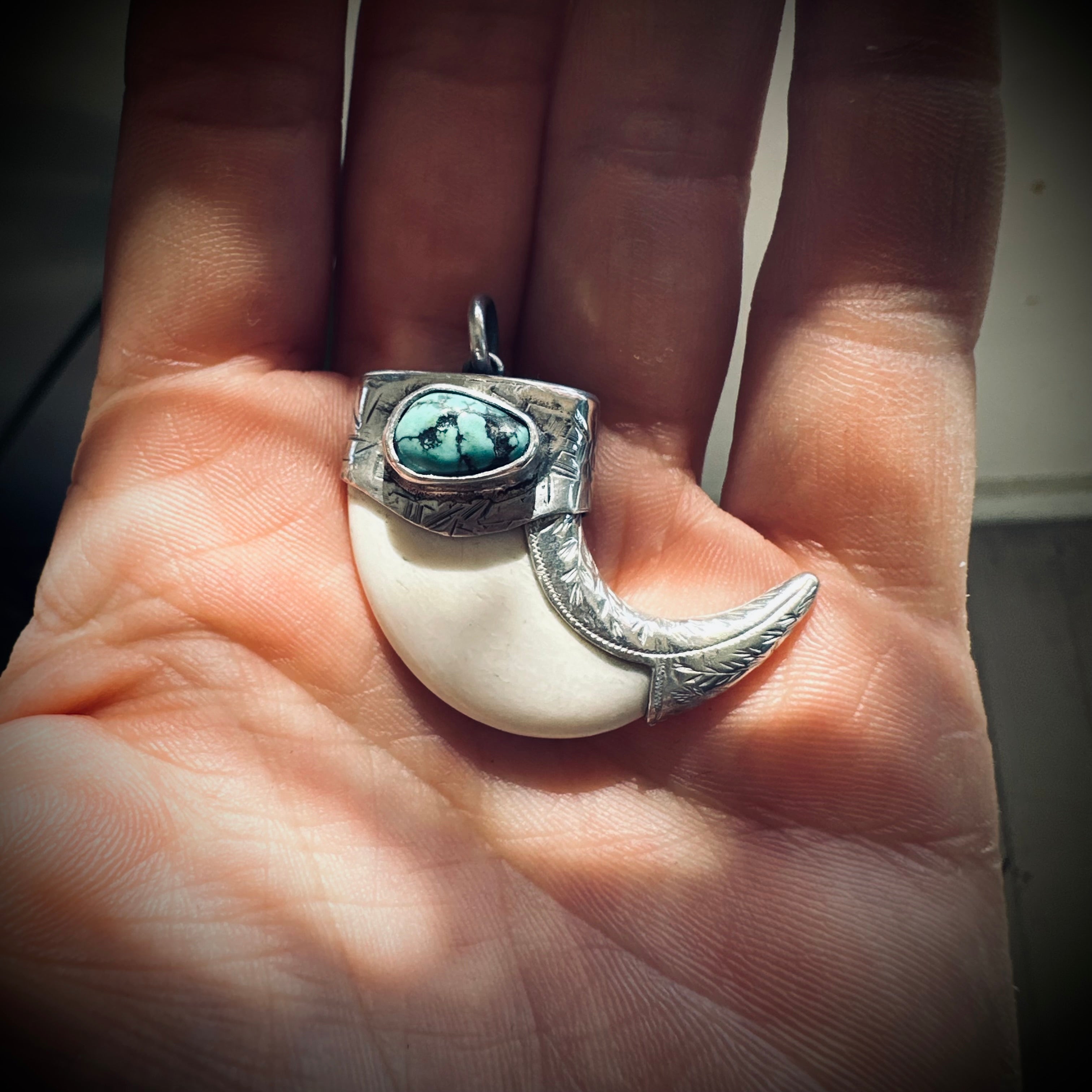 Sterling silver hallmarked claw-style pendant with turquoise and deer antler