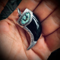 Carved onyx claw style pendant with turquoise in hallmarked sterling silver
