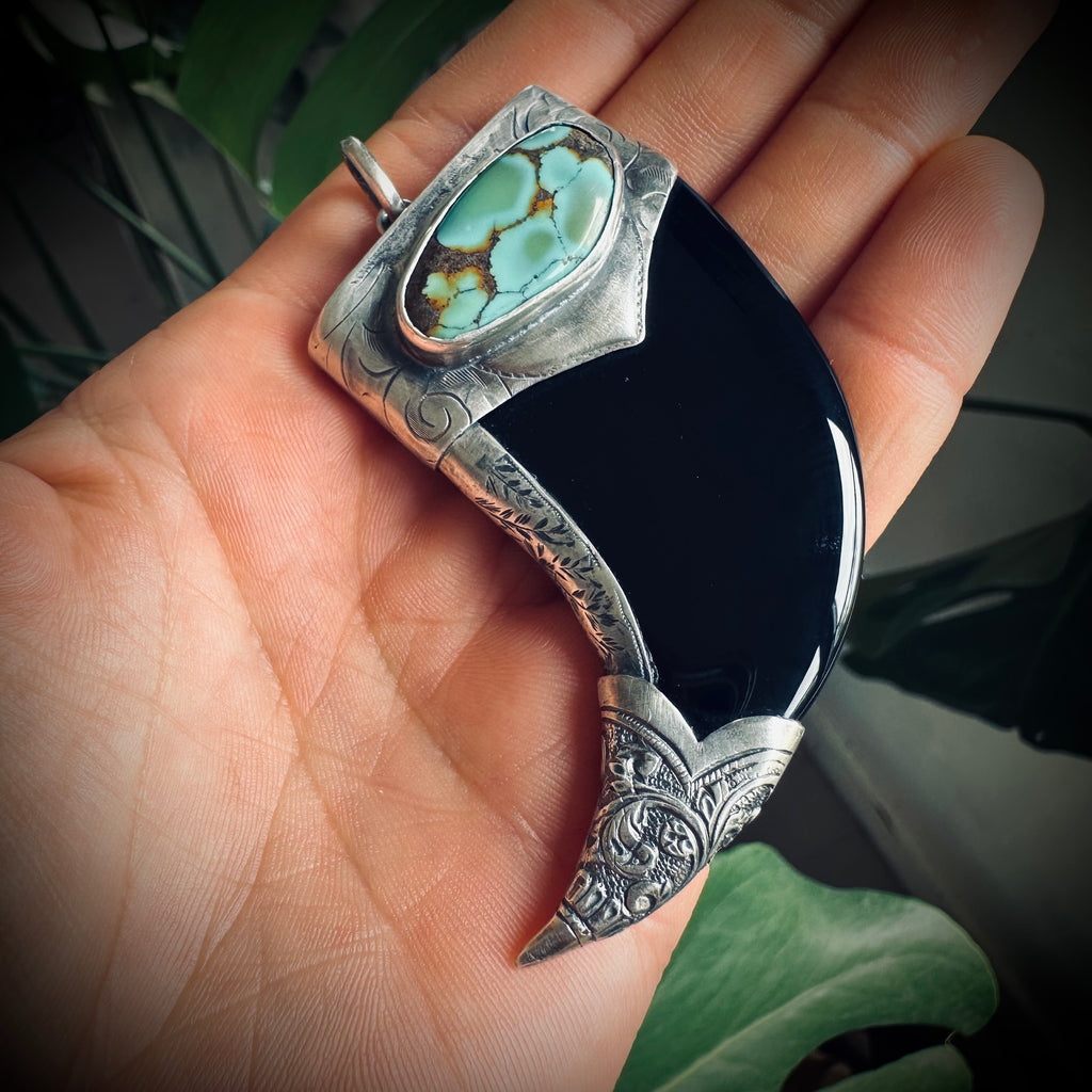 Carved onyx claw style pendant with turquoise in hallmarked sterling silver