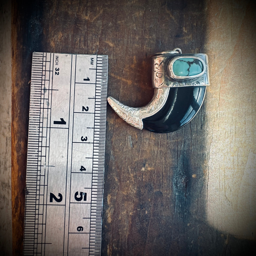 Sterling silver hallmarked claw-style pendant with turquoise and black buffalo horn