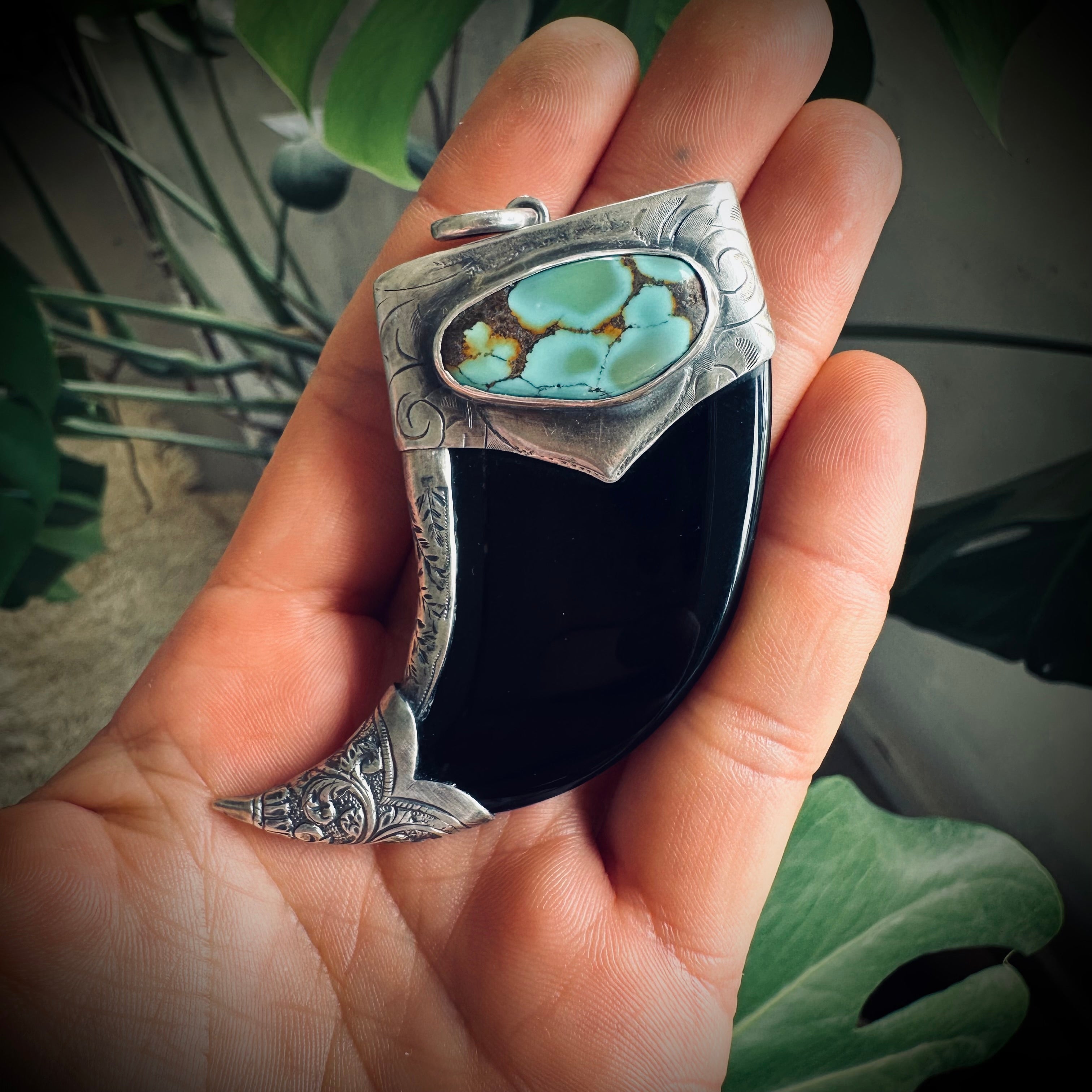 Carved onyx claw style pendant with turquoise in hallmarked sterling silver