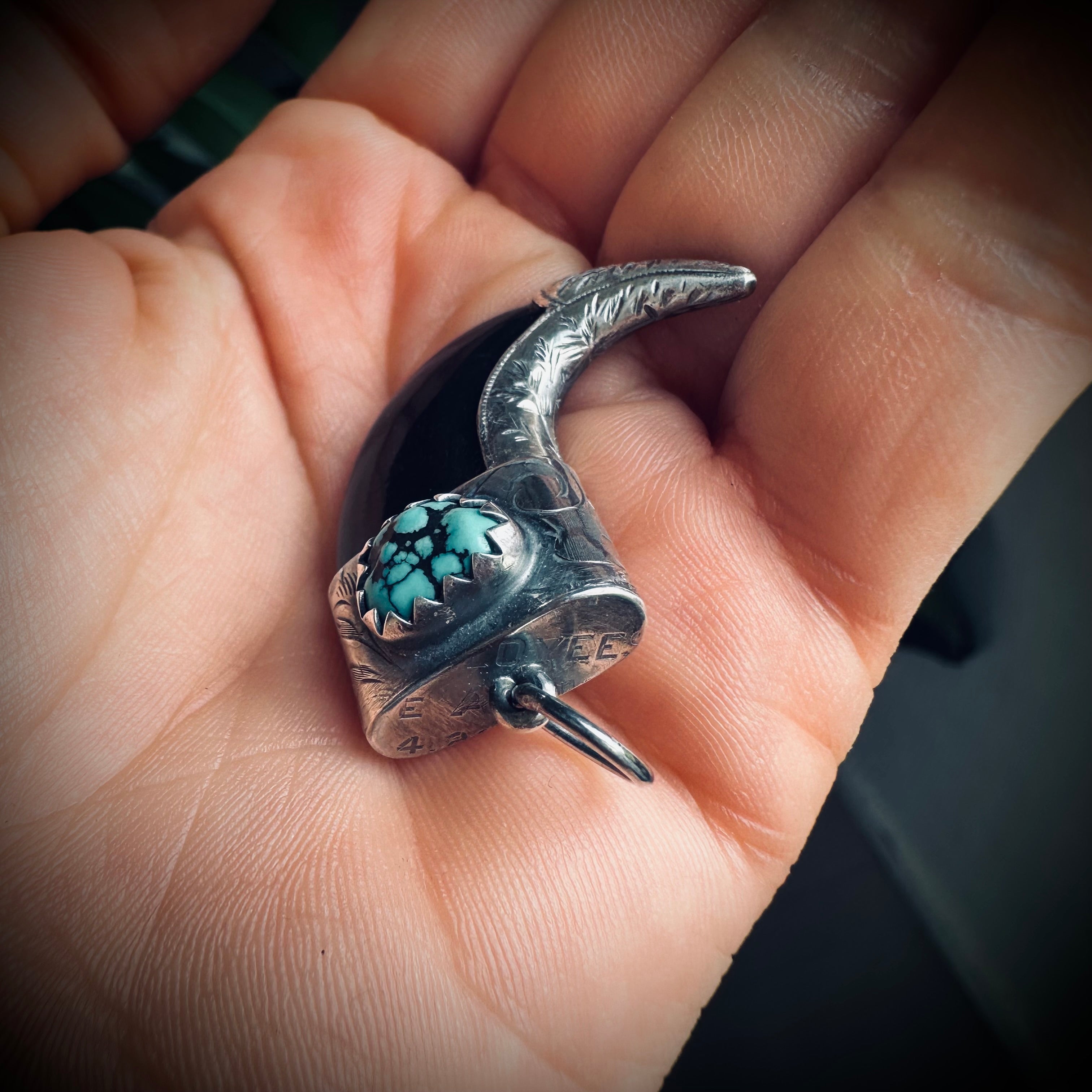 Carved buffalo horn “claw” pendant with turquoise in hallmarked sterling silver