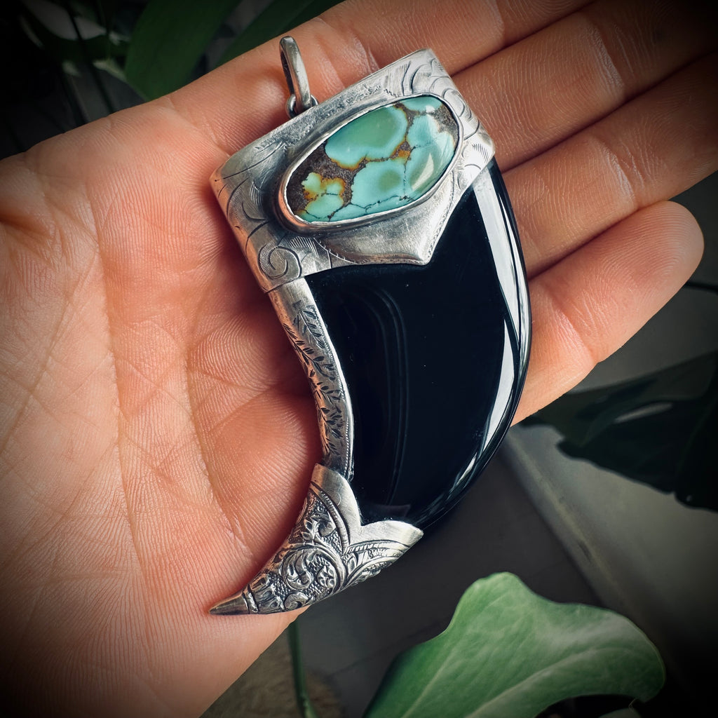 Carved onyx claw style pendant with turquoise in hallmarked sterling silver
