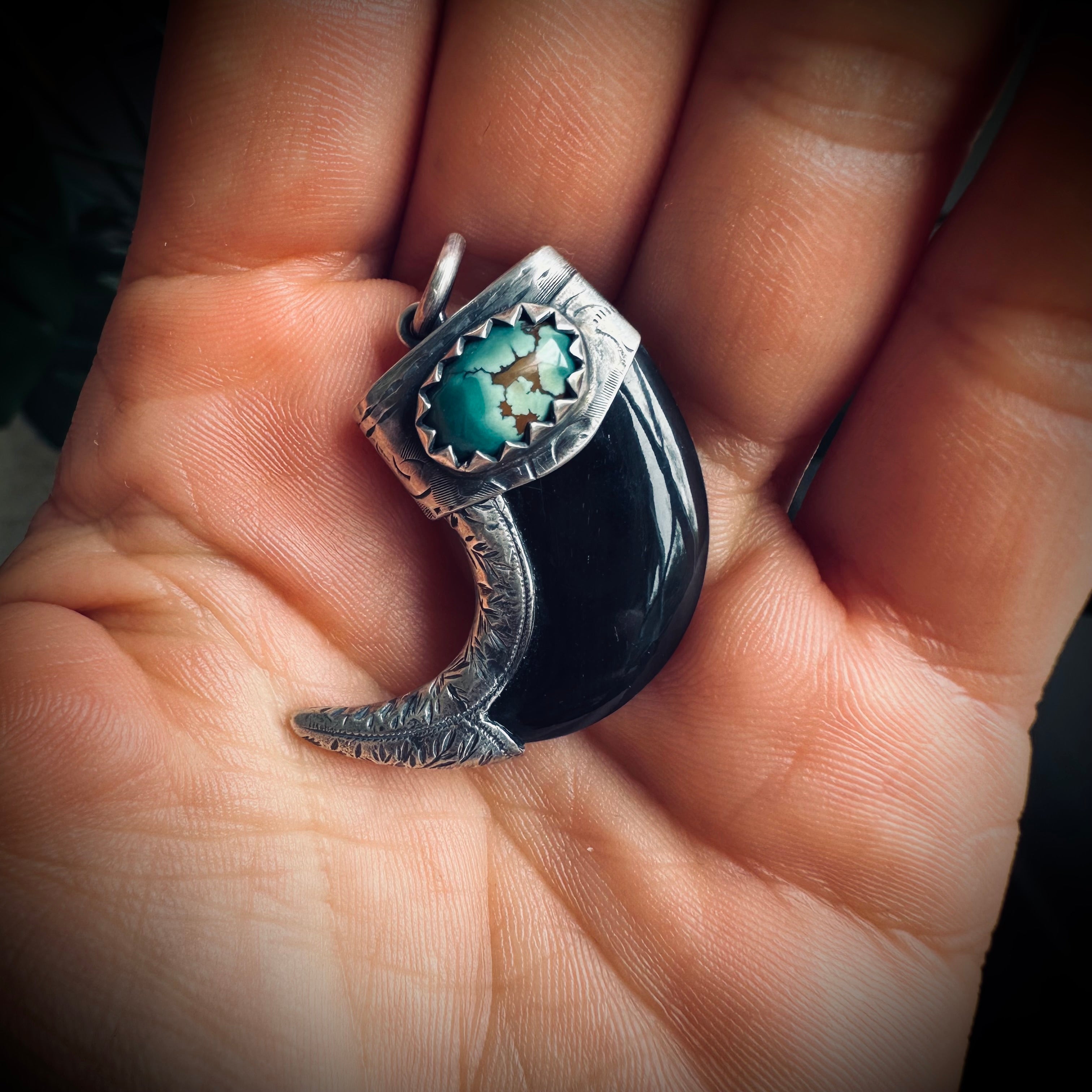 Carved buffalo horn claw style pendant with turquoise in hallmarked sterling silver