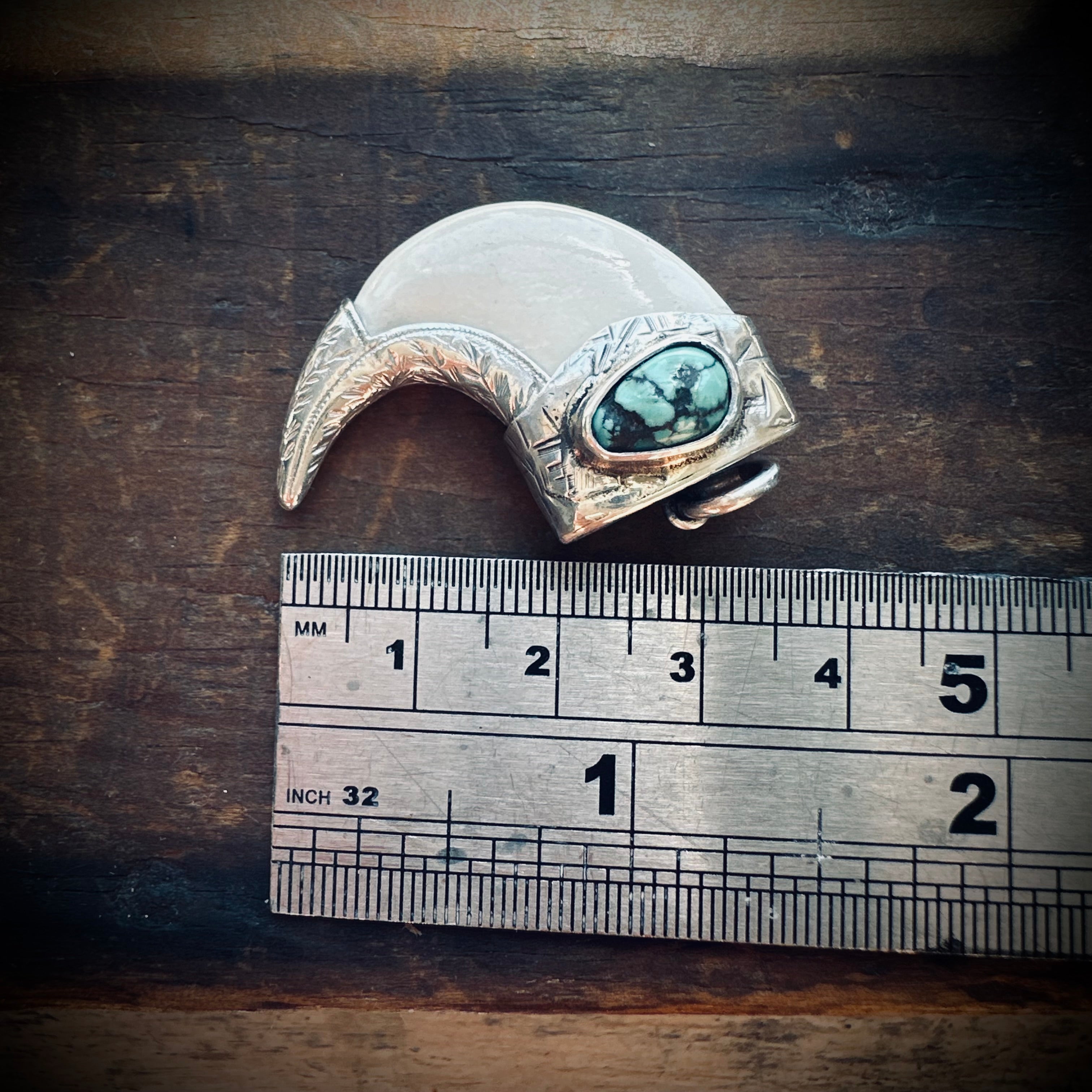 Sterling silver hallmarked claw-style pendant with turquoise and deer antler