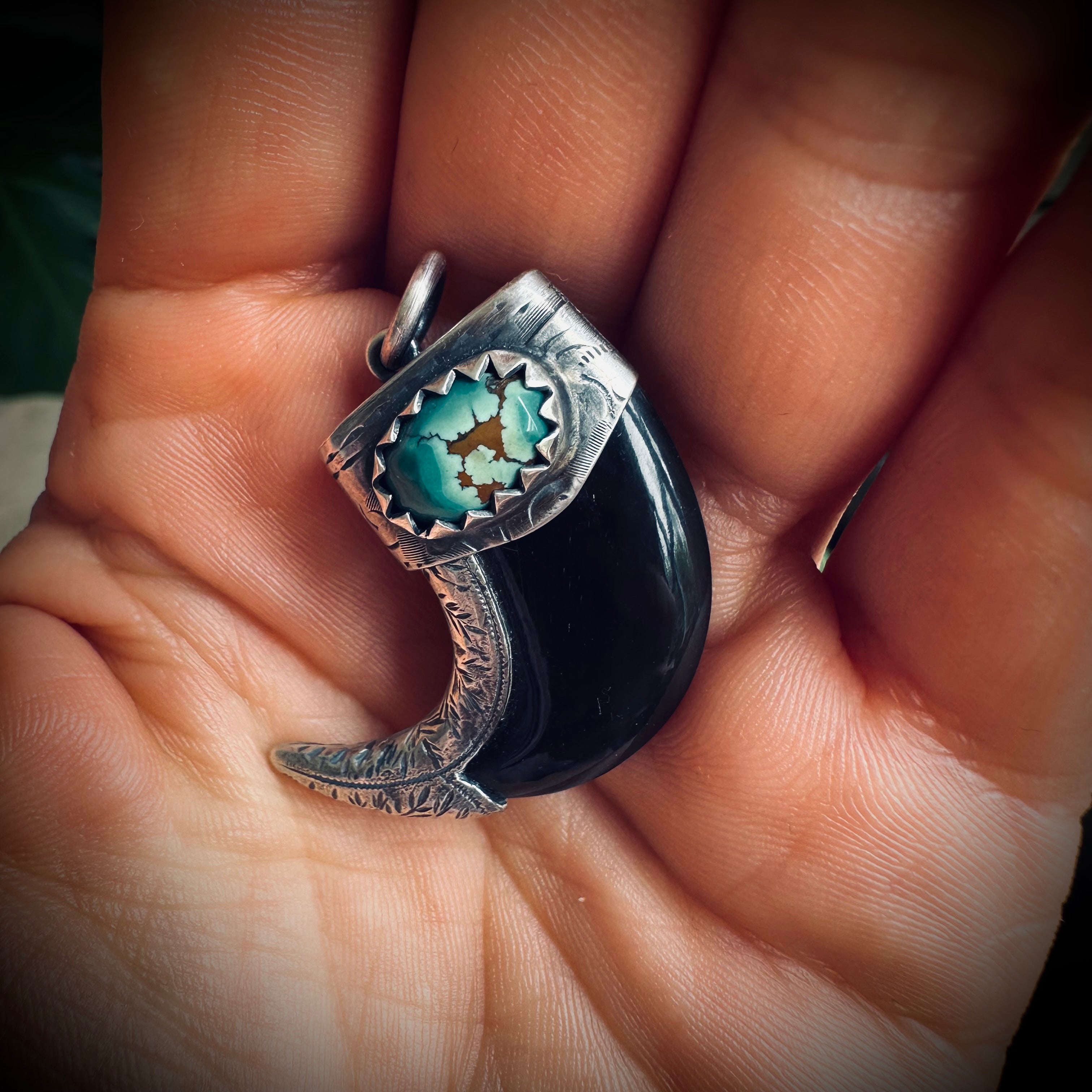 Carved buffalo horn claw style pendant with turquoise in hallmarked sterling silver