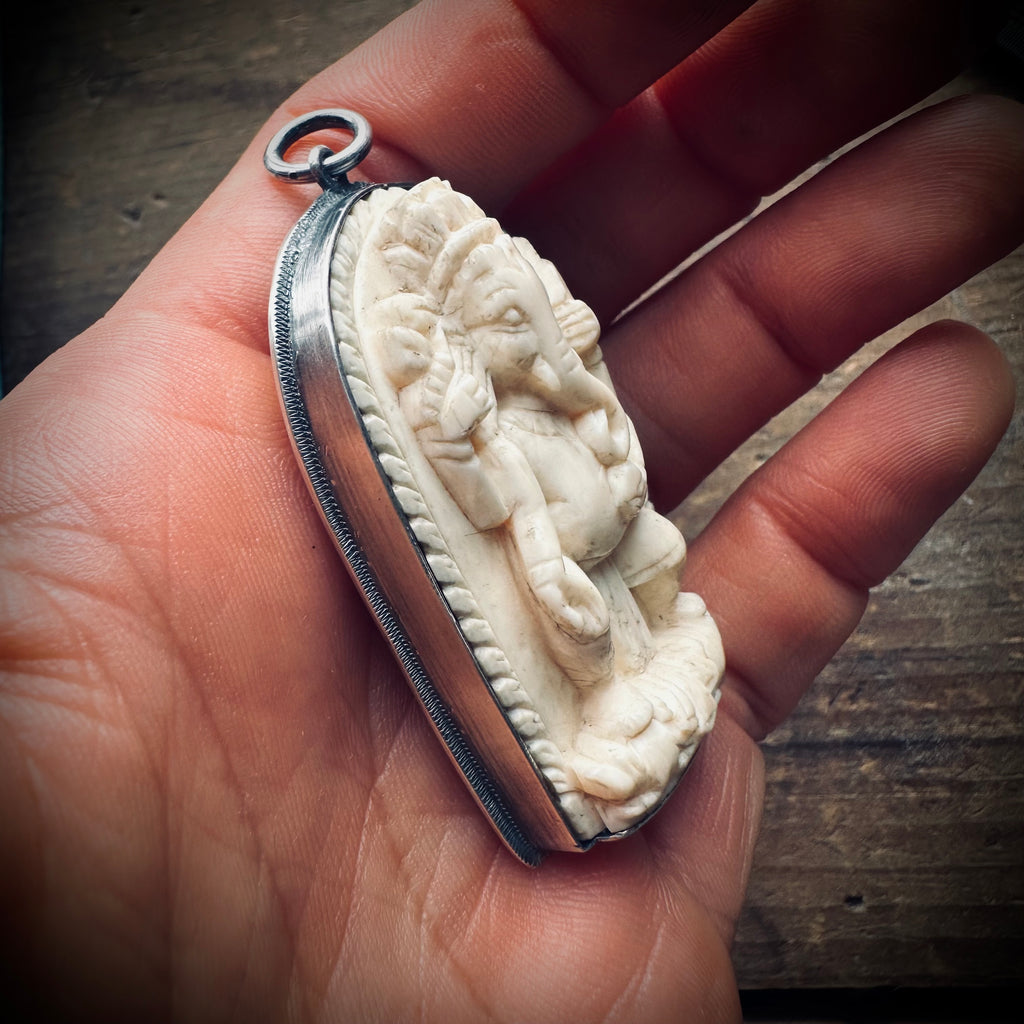 Reworked vintage carved bone Ganesha pendant in sterling silver ornate setting