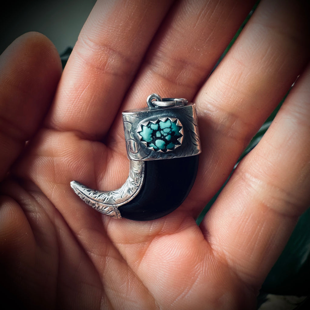 Carved buffalo horn “claw” pendant with turquoise in hallmarked sterling silver